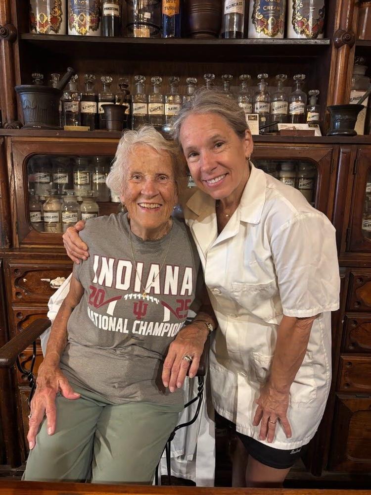 Tish Brafford, left, and Suzie Glaze, the respective great niece and great-great niece of Hook’s founder John Hook, volunteered at the Hook’s Drugstore Museum during the most recent Indiana State Fair in August. Photo by Lauren Warner, TheStatehouseFile.com.